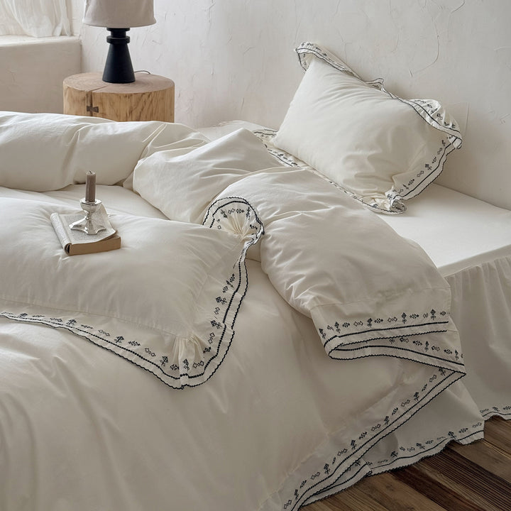 Luxurious embroidered bedding set with ruffled hem
