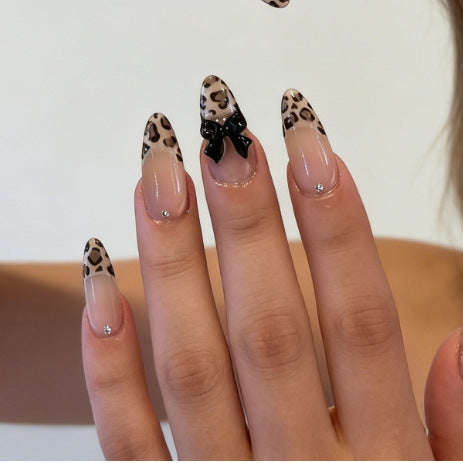 Artificial nail tips with elegant leopard pattern and bow decoration Kalsten