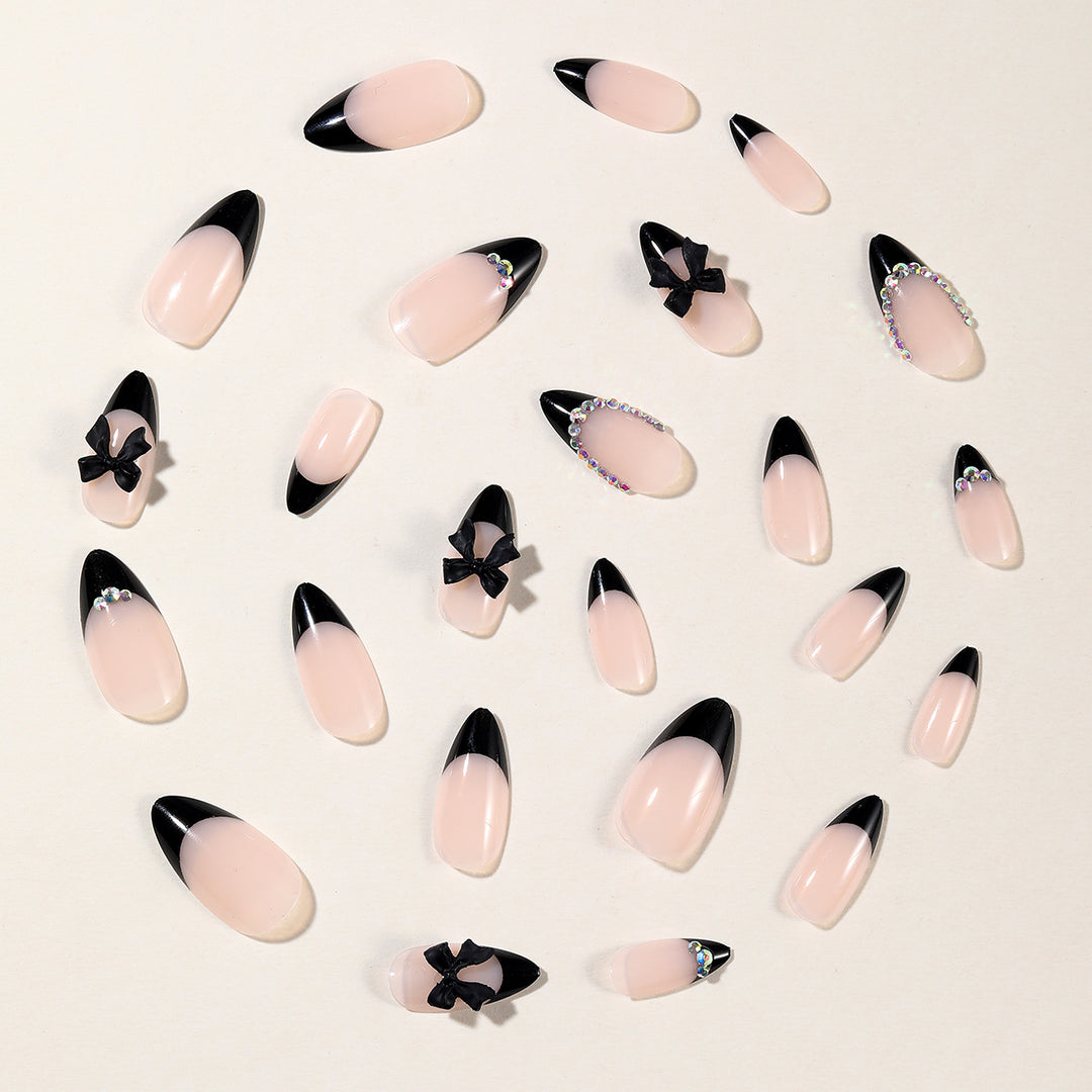 Elegant Stiletto Nail Design with Rhinestone Accents Kalsten