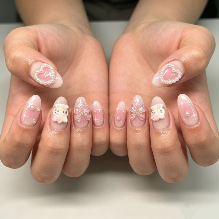 Playful artificial nails with heart and kitty motifs Kalsten
