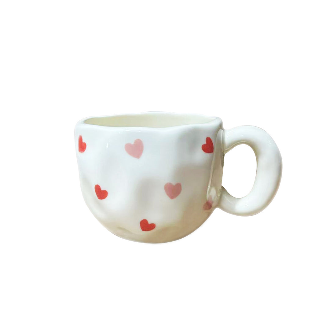 Ceramic mug with hand-painted tulip pattern and organic shape