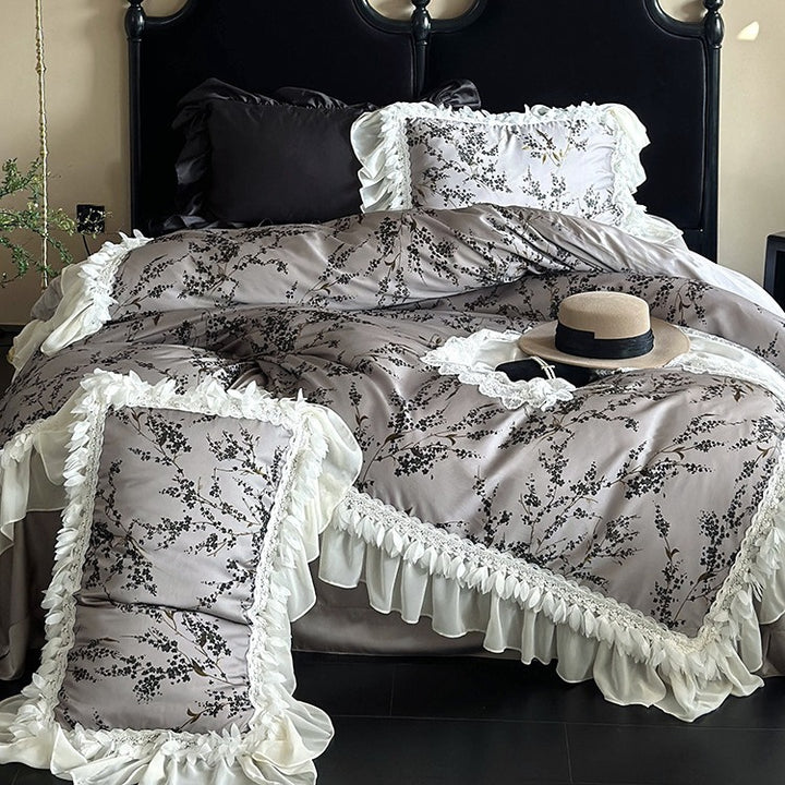 Satin bedding set with floral print duvet, tiered ruffle pillow & lace trim