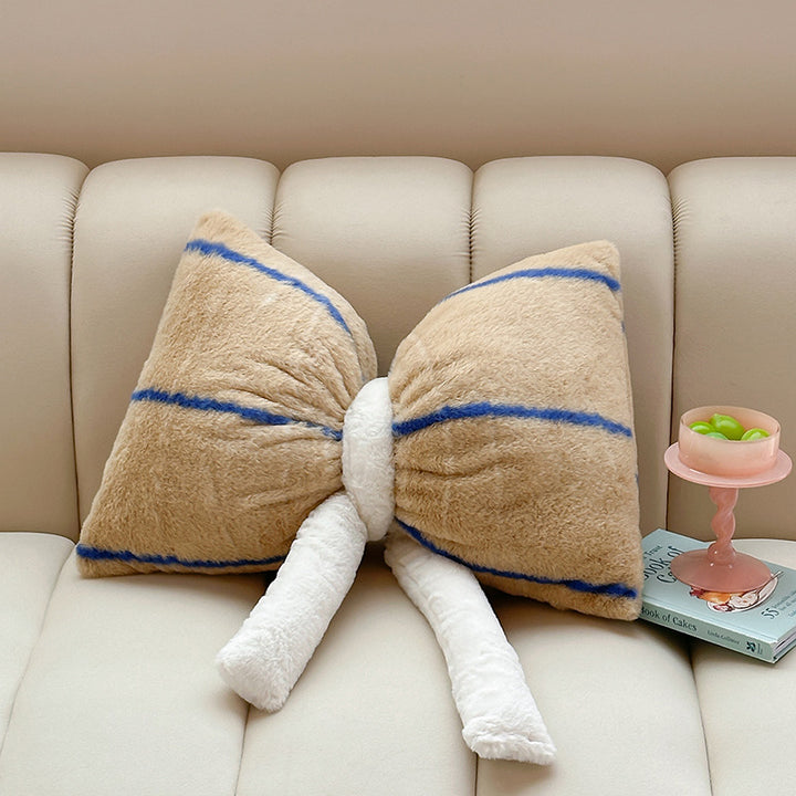Cuddle cushion in bow shape made of plush with striped texture