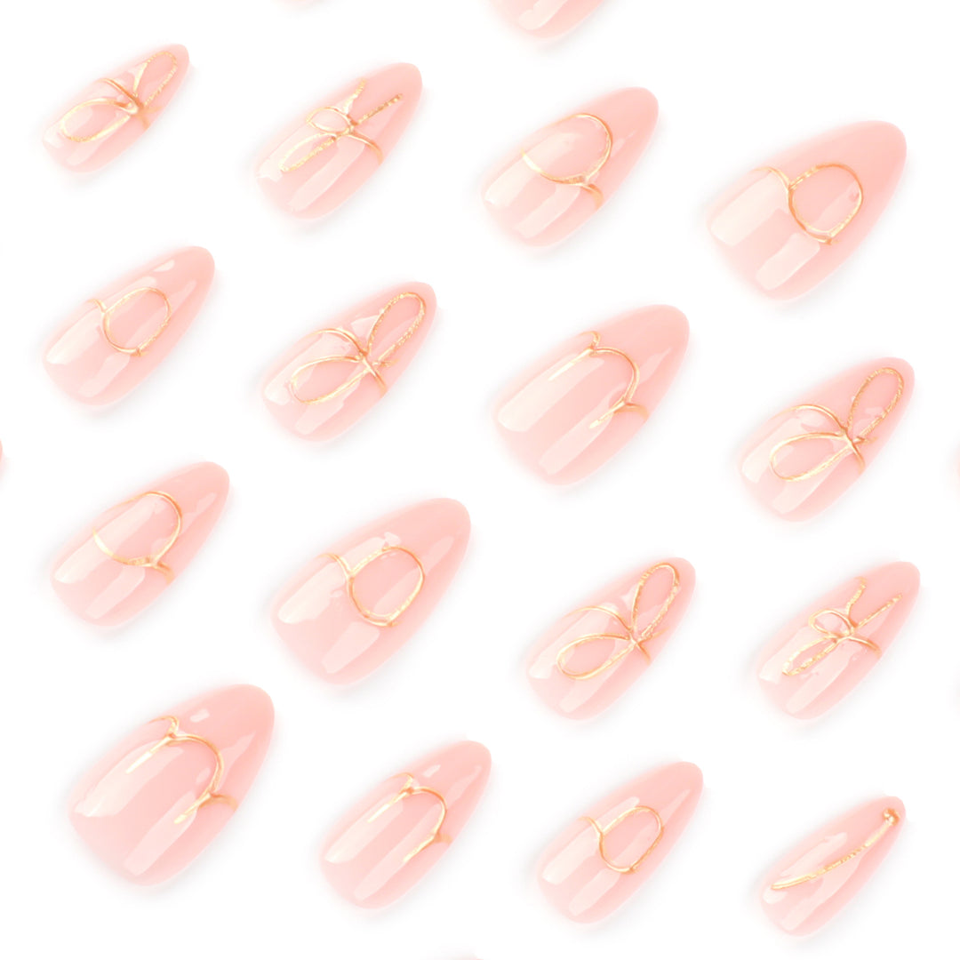 Creative nail art with golden accents and trendy lettering Kalsten