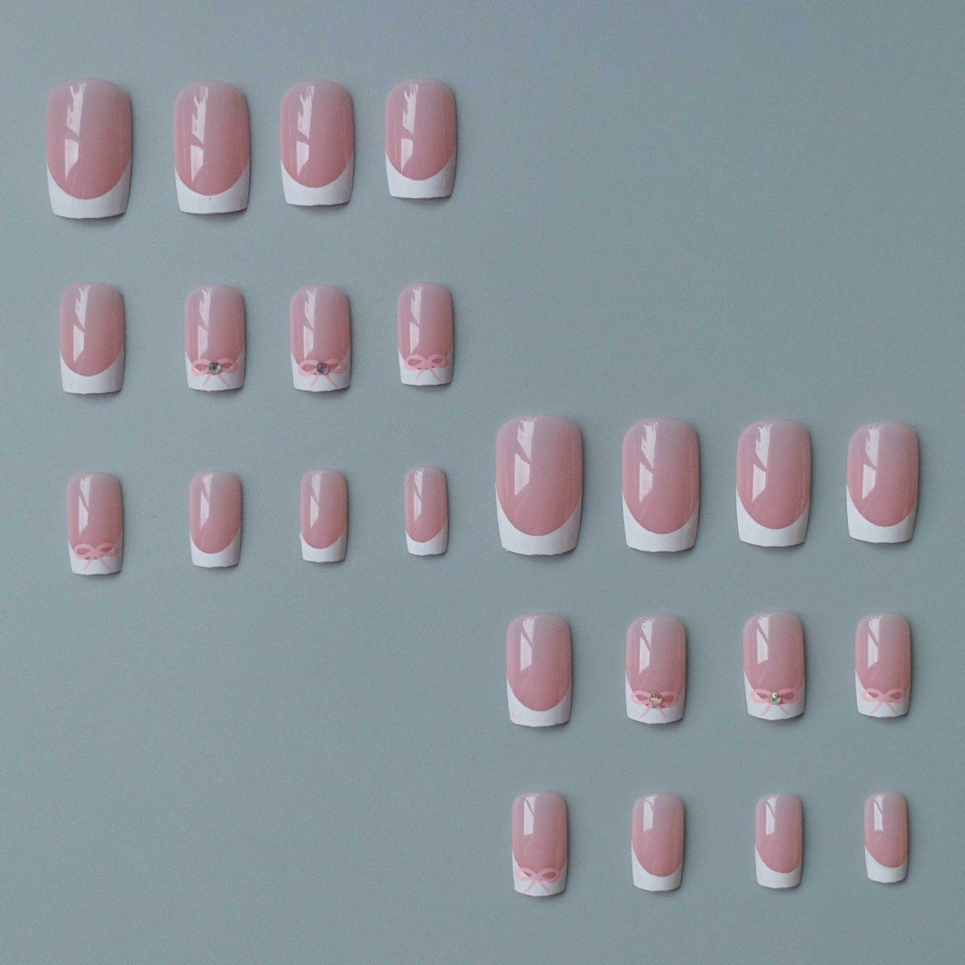 Elegant French Tip Nail Art Set with Delicate Bow Accents
