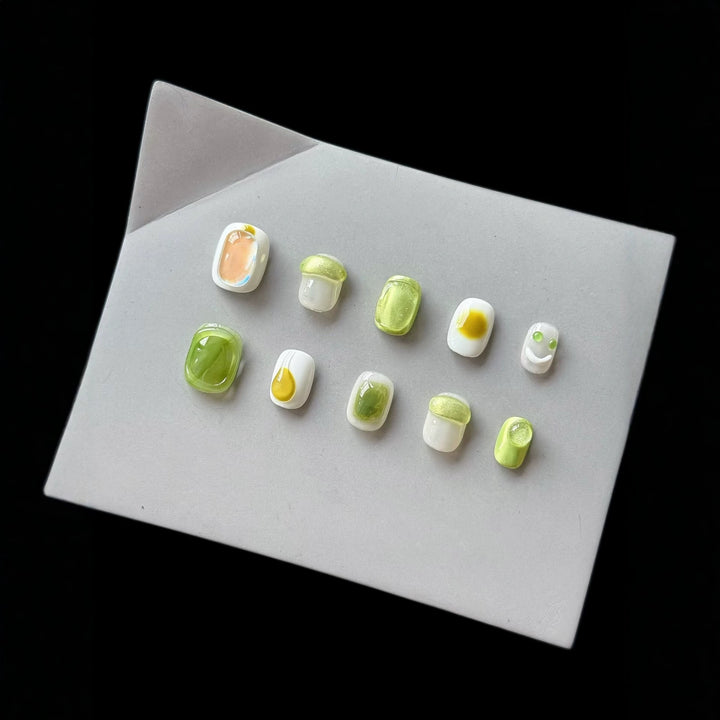 Artistic Press-On Nail Art Set with Playful Character Designs