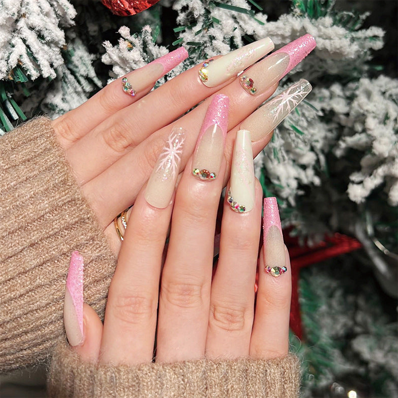Artistic stiletto nails with glitter and snowflake design Kalsten