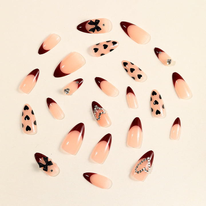 Artistic Stiletto Nail Art Extensions with Heart and Bow Accents Kalsten