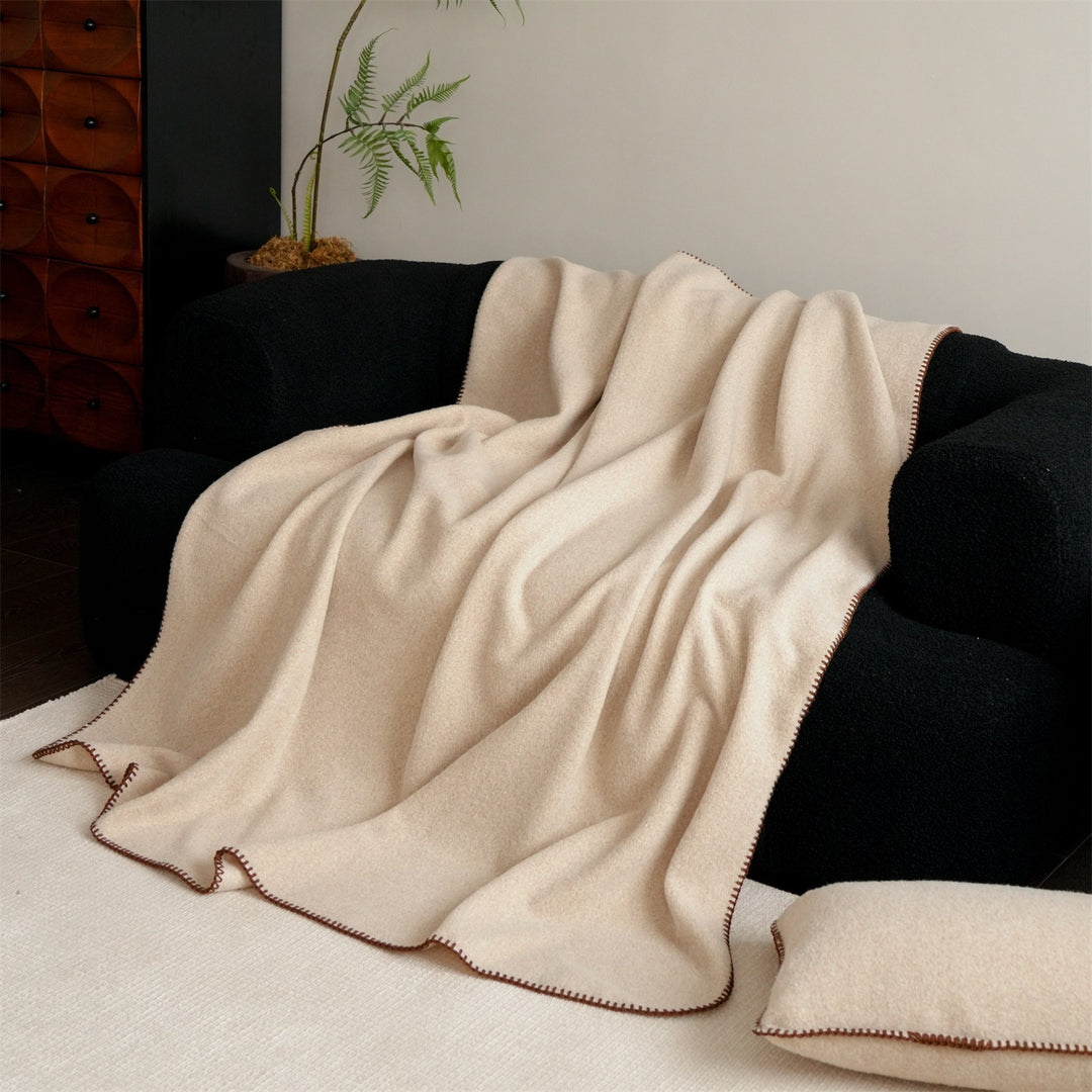 Premium wool blanket with fine hand-stitched edge and particularly soft drape