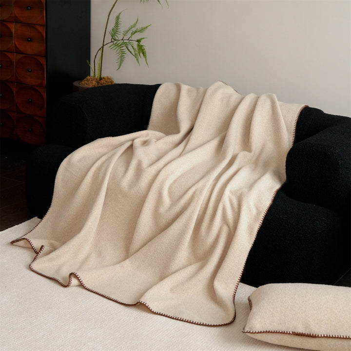 Premium wool blanket with fine hand-stitched edge and particularly soft drape