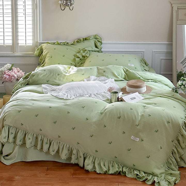Vintage-inspired bedding set with ruffles and delicate floral embroidery