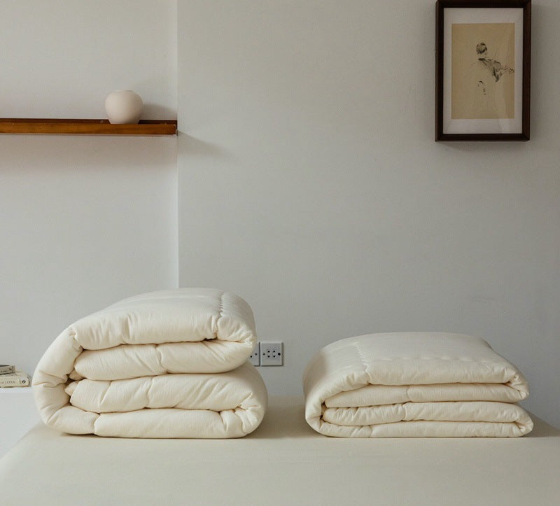 Light climate-regulating cassette quilt with hypoallergenic microfiber filling