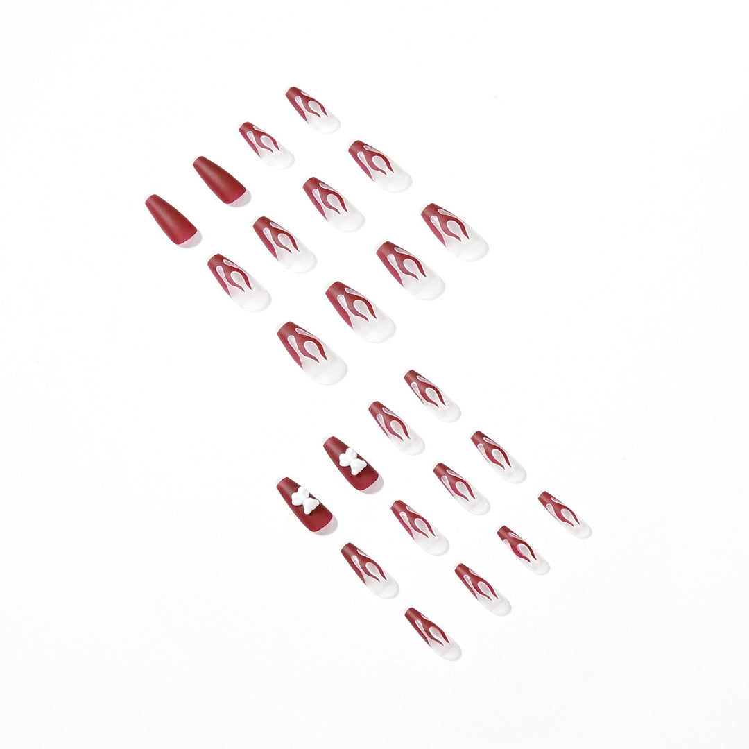Artful stiletto nails with fiery flame design Kalsten