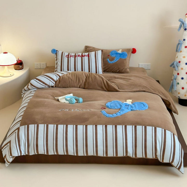 Children's bedding set with elephant applique made of cozy velour and striped cotton side