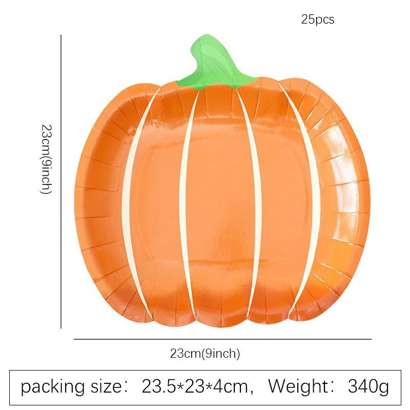 Disposable paper plates in pumpkin shape with spooky face design
