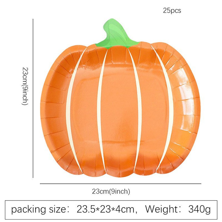 Disposable paper plates in pumpkin shape with spooky face design