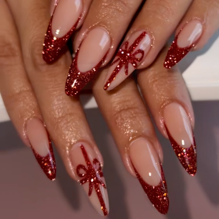 Nail set with glamorous glitter accents and bow design Kalsten