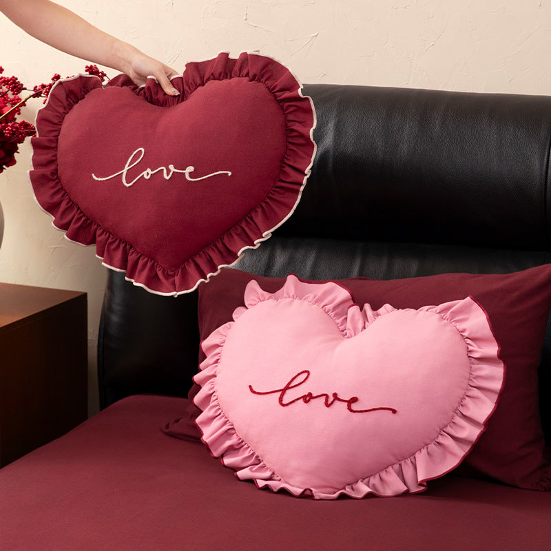 Heart-shaped decorative cushion with ruffles and embroidered text Kalsten