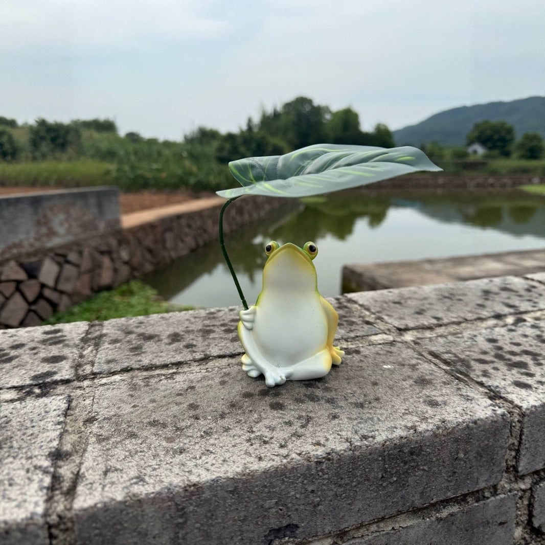 Playful frog decorative figure with leaf Kalsten