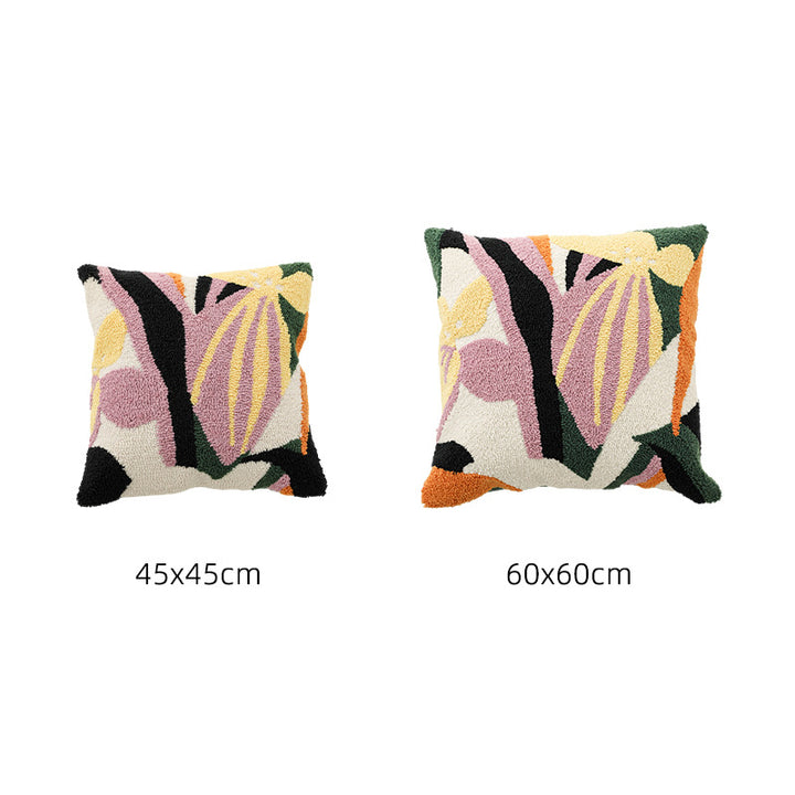 Hand-tufted decorative cushion with abstract graphic design and textured cotton surface