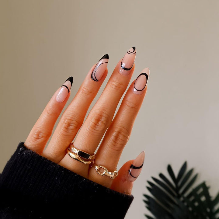 Artful stiletto nails with geometric accents Kalsten
