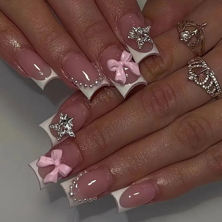 Artificial nail tips with glamorous bow and rhinestone design Kalsten