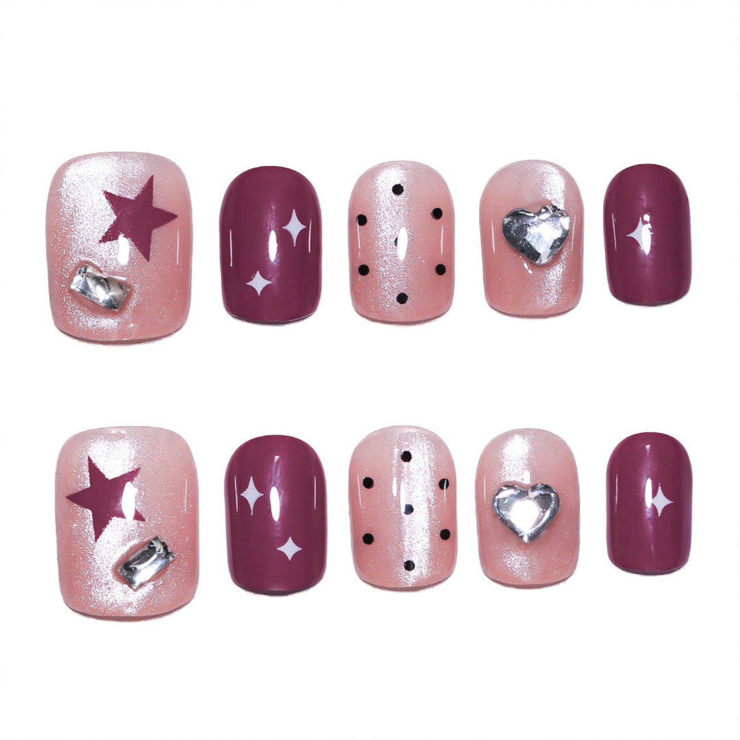 Artificial nail extensions with unique jewelry accents Kalsten