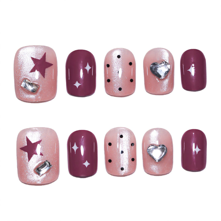 Artificial nail extensions with unique jewelry accents Kalsten