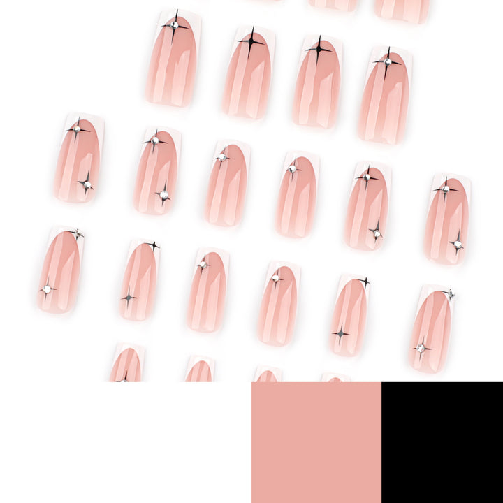 Artificial nail extensions with elegant French tip and glitter accents Kalsten
