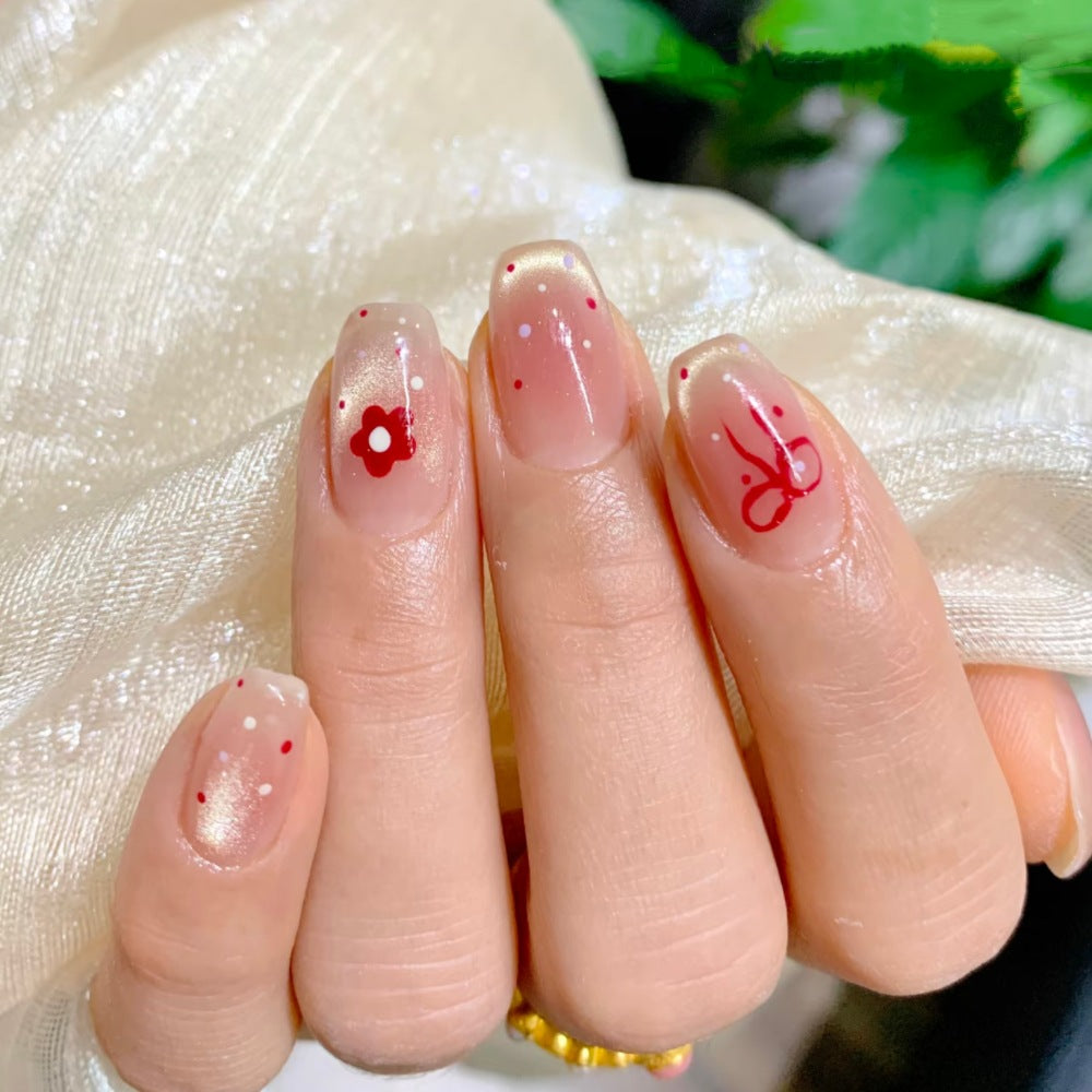 Artificial nails with sparkling accents and delicate patterns Kalsten