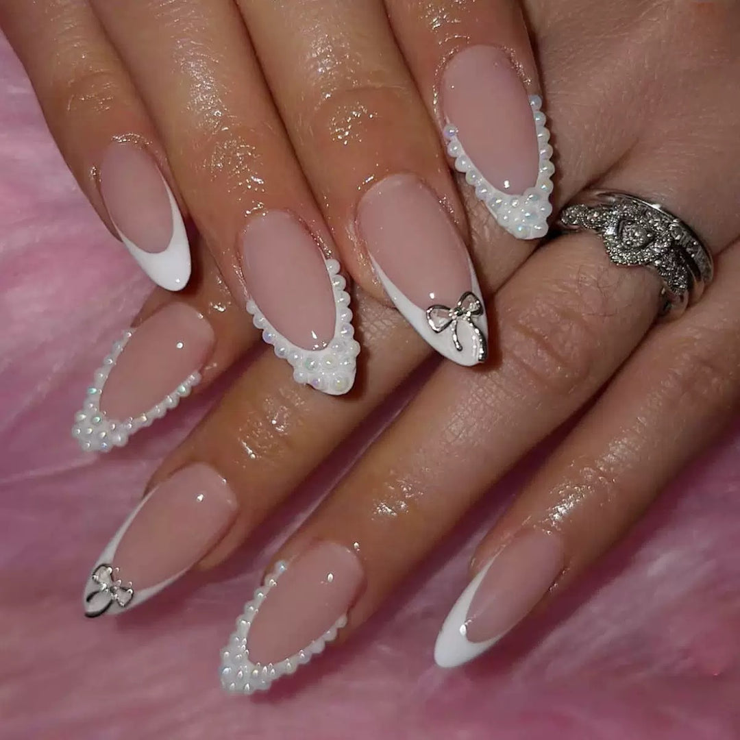 Acrylic nail set with elegant pearl and bow decorations Kalsten