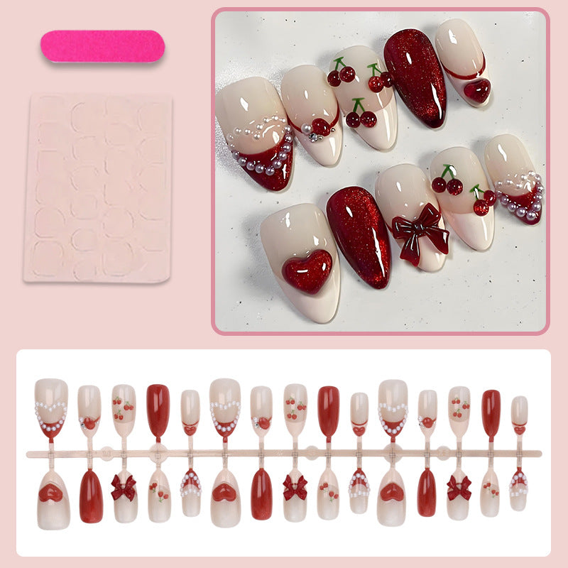 Artificial nail set with romantic berry designs and glamorous embellishments Kalsten