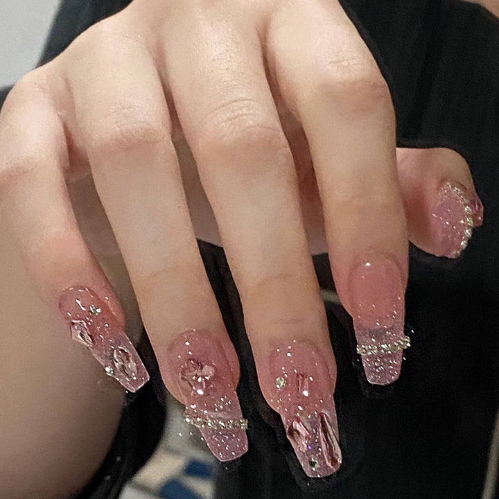Artificial nails with heart design and glitter accents Kalsten