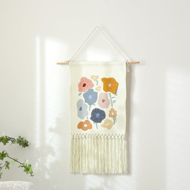 Woven cotton wall hanging with punch needle flower relief and fringes Kalsten