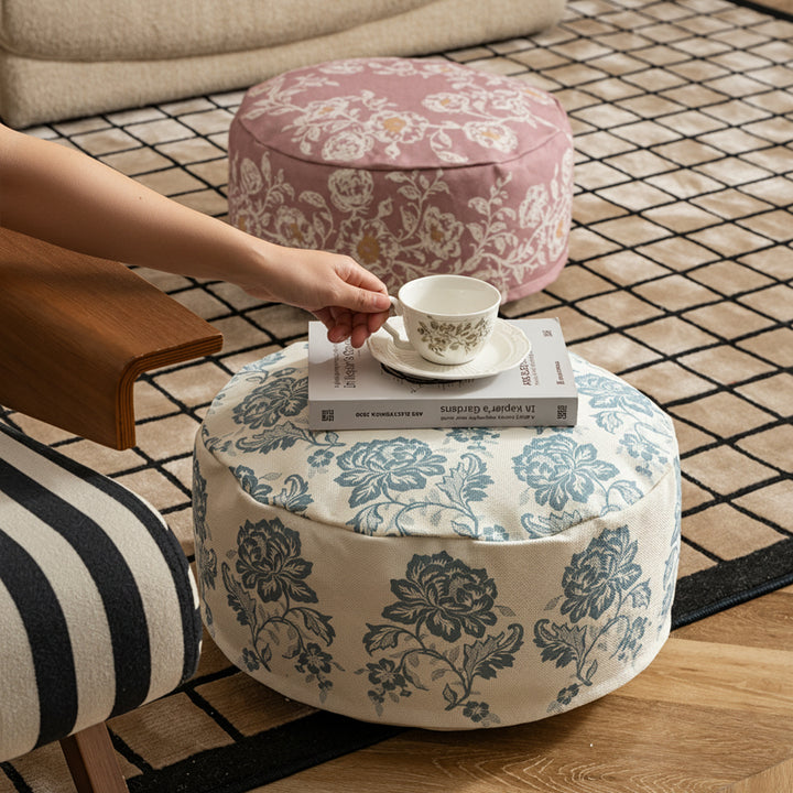 Round seat pouf with floral jacquard weave, stable upholstery core, and carrying handle Kalsten