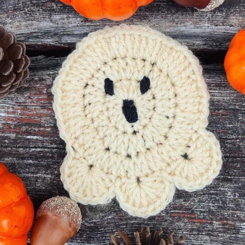 Hand-crocheted pumpkin pot holder and table mat made of cotton yarn