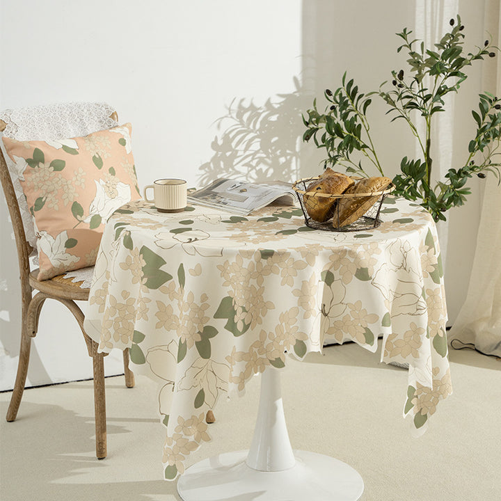 Round wipeable tablecloth with floral cut-out hem Kalsten