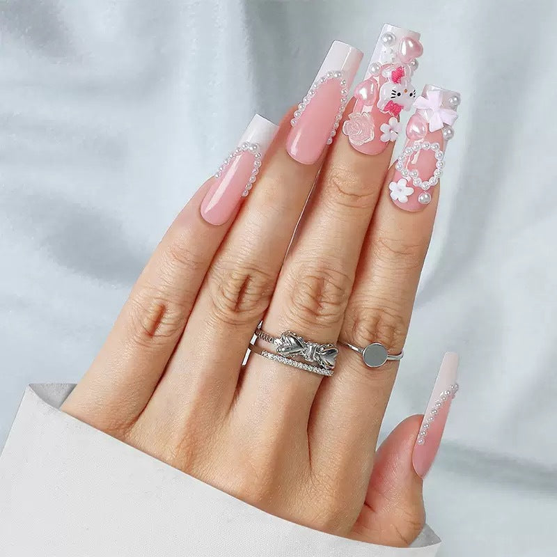 Acrylic nail set with playful 3D accents and pearl details Kalsten
