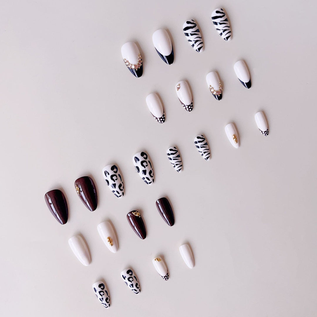 Acrylic nail set with luxurious animal motif designs and glamorous accents Kalsten