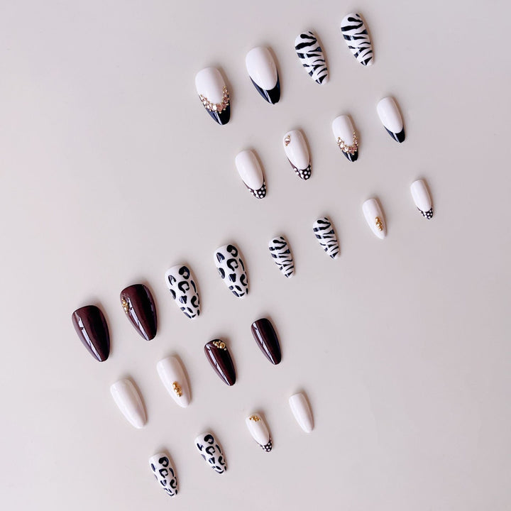 Acrylic nail set with luxurious animal motif designs and glamorous accents Kalsten