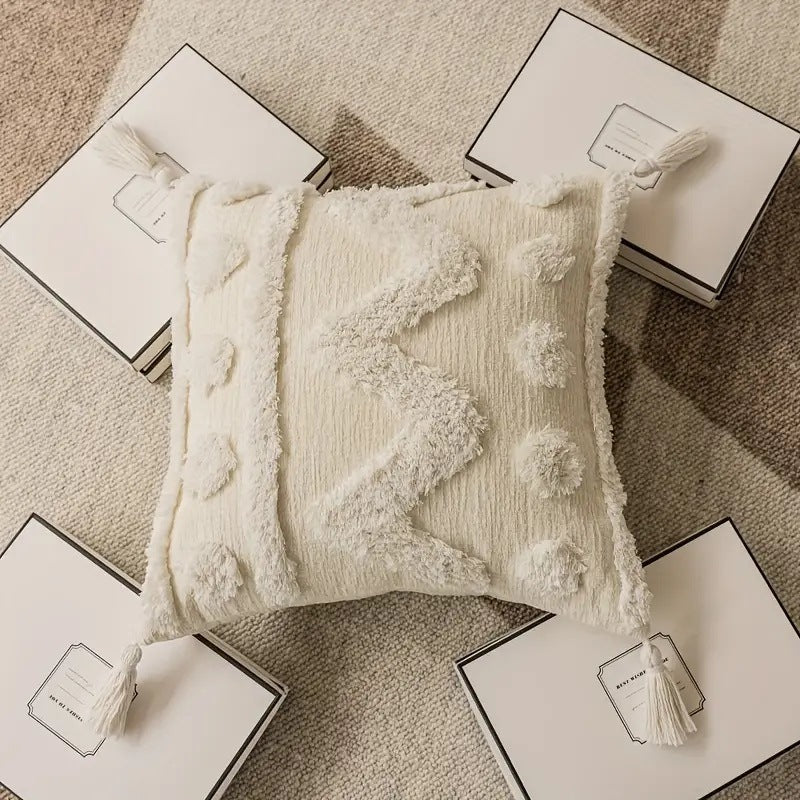 Rectangular decorative cushion cover with hand-tufted chevron and pompom relief as well as corner tassels Kalsten