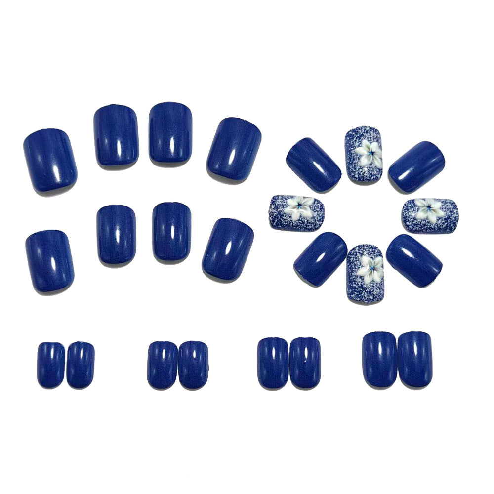 Artificial nails in elegant glitter design with floral embellishments Kalsten