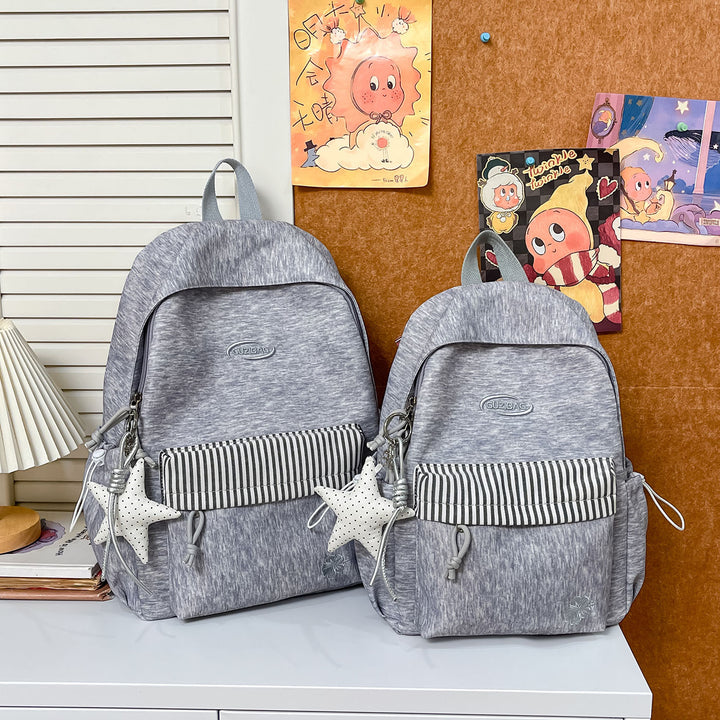 Stylish Versatile Backpack with Decorative Accessories