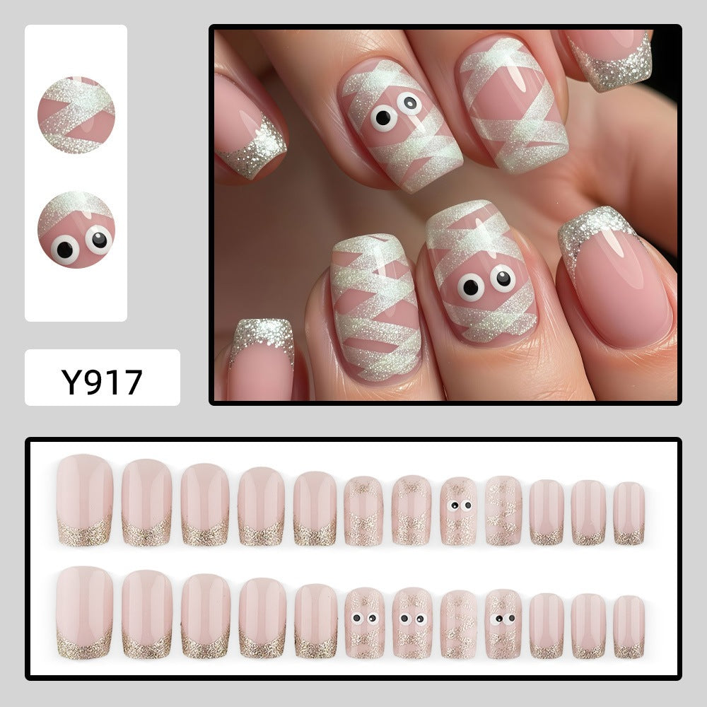 Artificials nails with playful eye design and glitter tips Kalsten