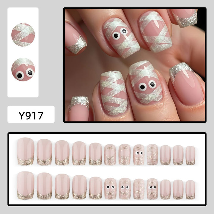 Artificials nails with playful eye design and glitter tips Kalsten
