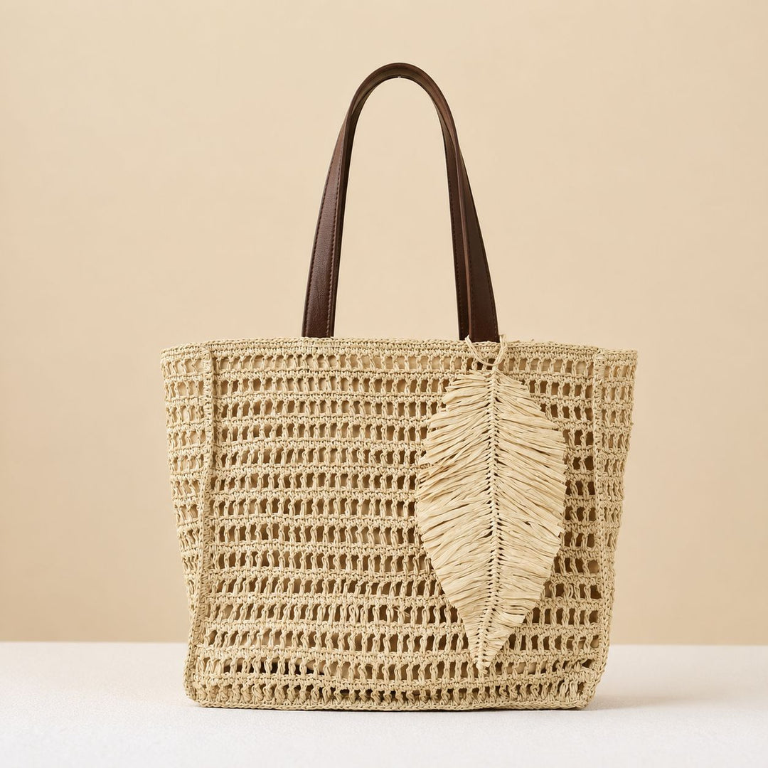Handbag made of hand-woven natural material with decorative leaf shape design Kalsten