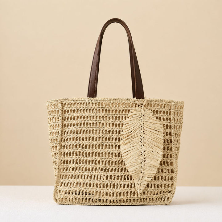 Handbag made of hand-woven natural material with decorative leaf shape design Kalsten