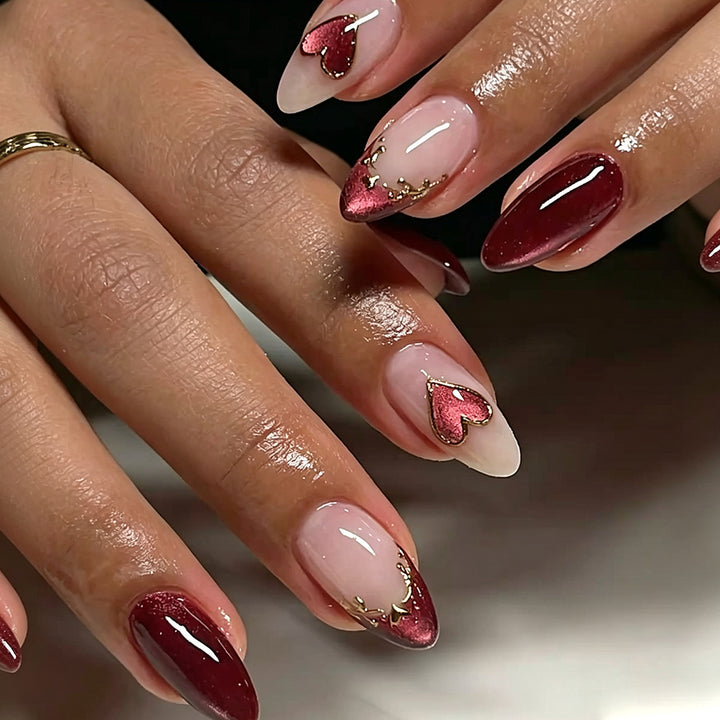 Artful stiletto nails with heart designs and glitter embellishment Kalsten