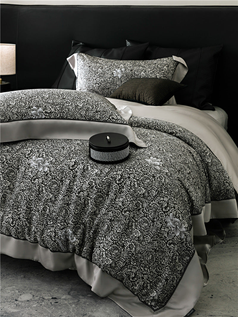 Duvet cover set made of cotton satin with subtle watercolor flower print and silky-matte texture