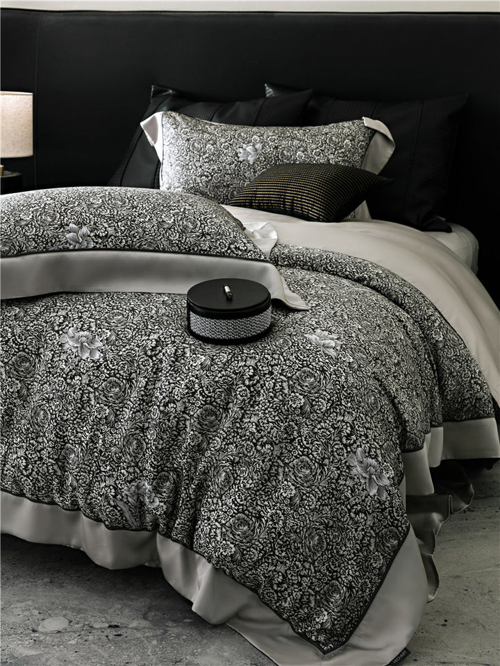 Duvet cover set made of cotton satin with subtle watercolor flower print and silky-matte texture
